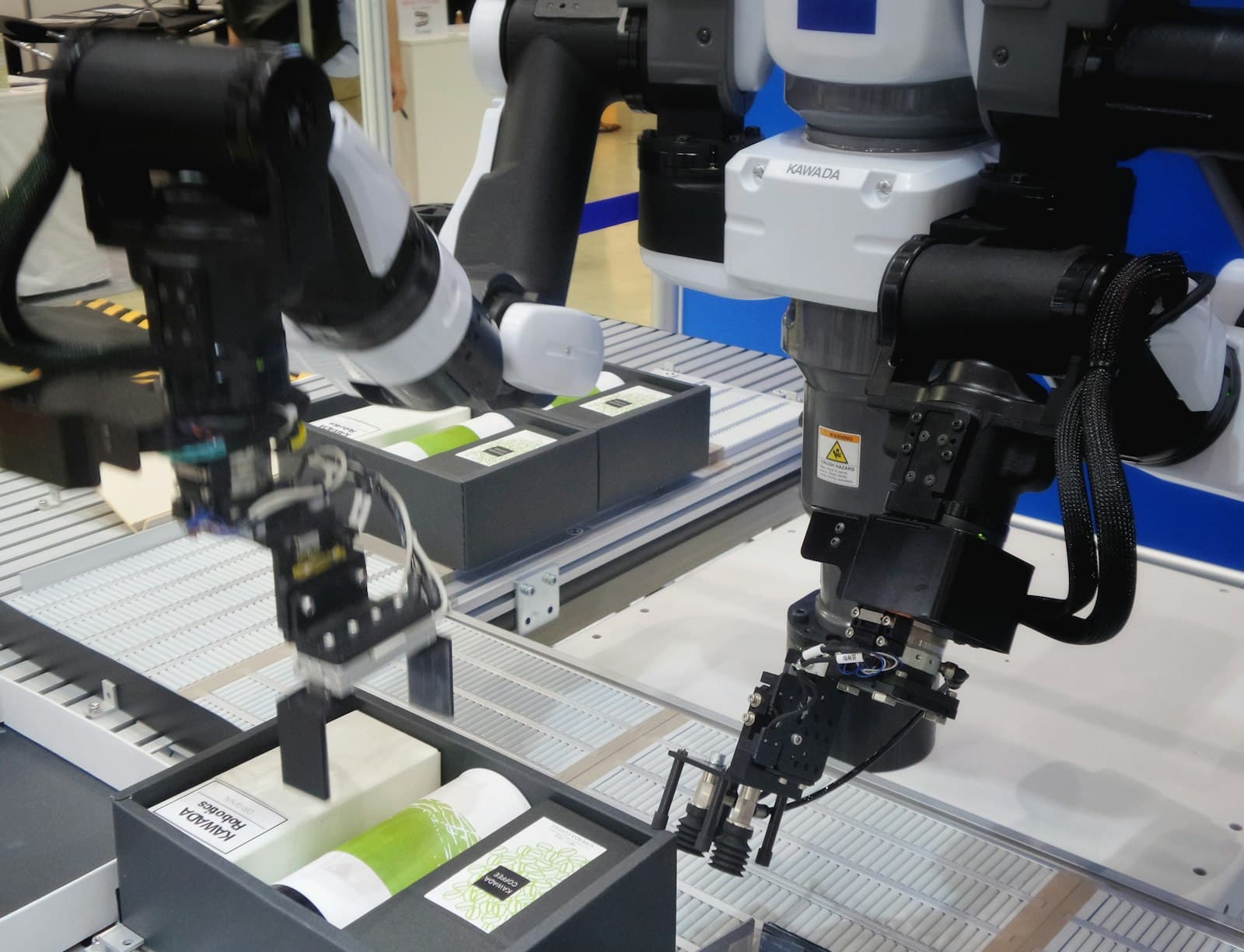 Industrial robot arms working over a production line
